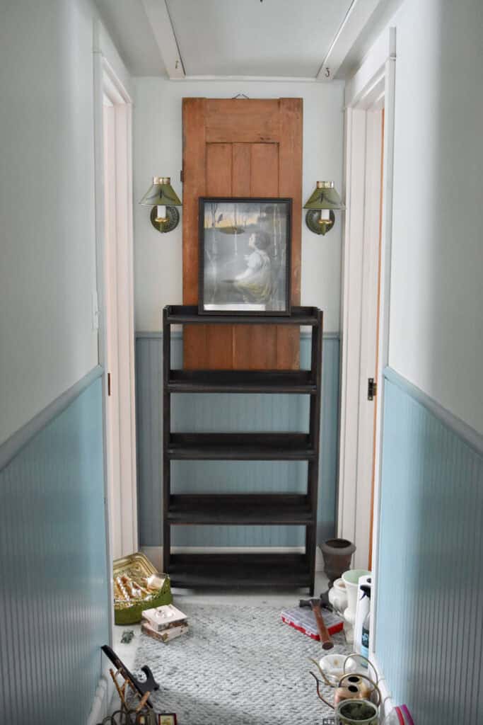 Bookshelf at end of hallway ready for Spring decor.