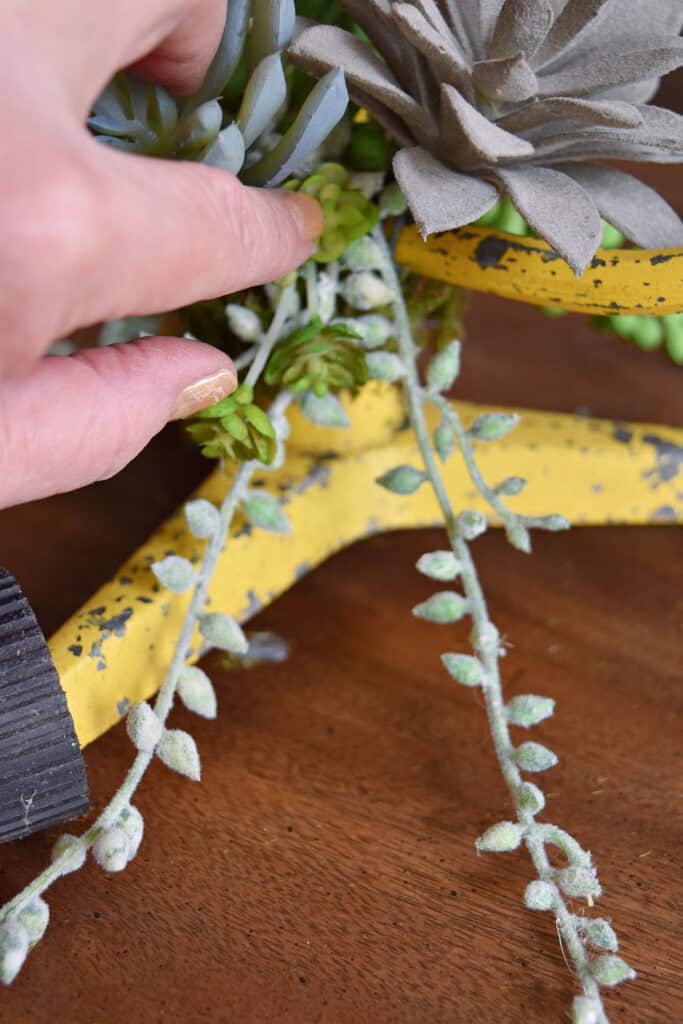 Crafting succulent sprinkler art.