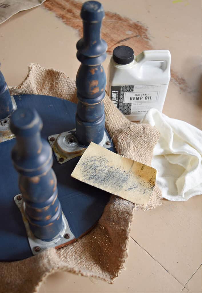 Sanding old footstool legs for makeover.