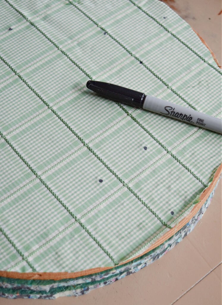 Sharpie on green fabric.