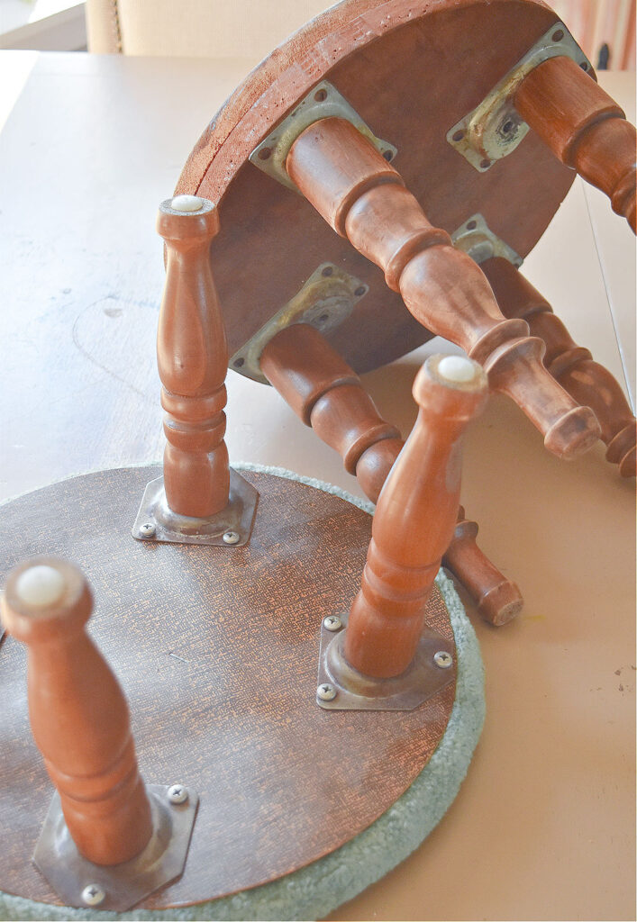 Old wooden upholstered footstools