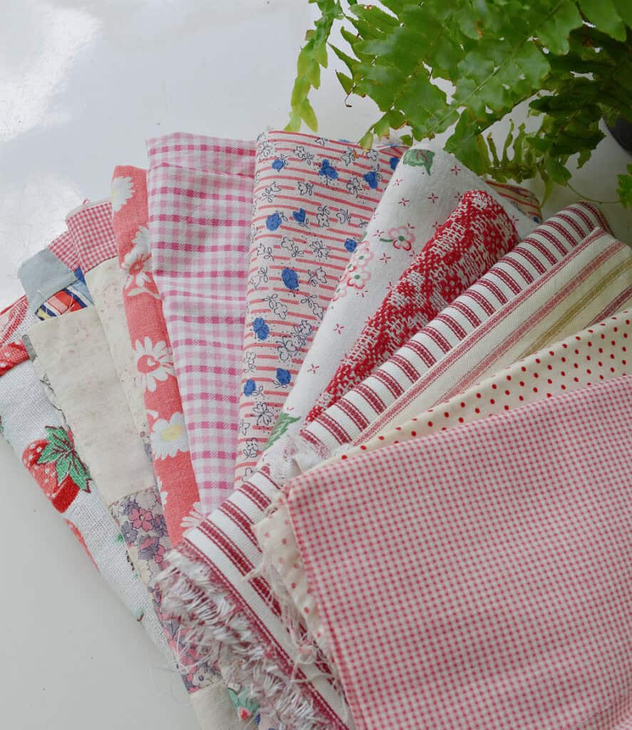 Red patterned fabrics to make upcycled strawberries.
