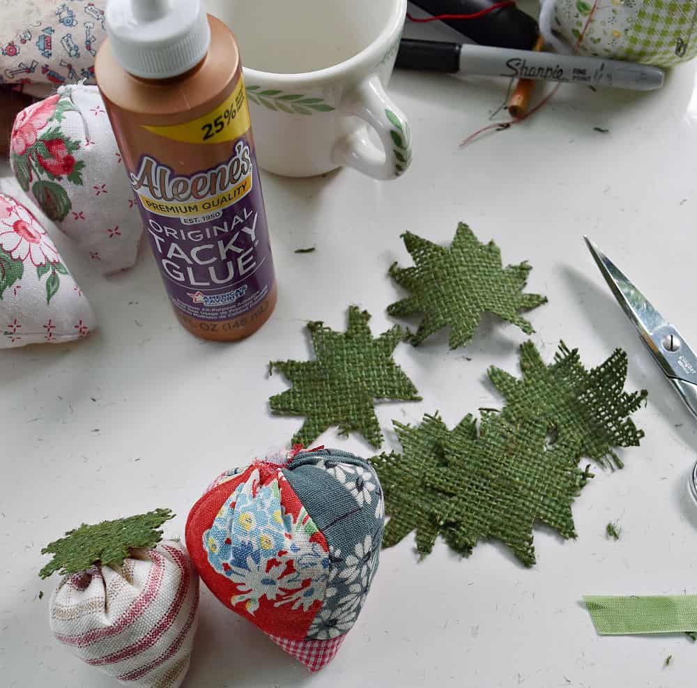 Crafting upcycled fabric strawberries.