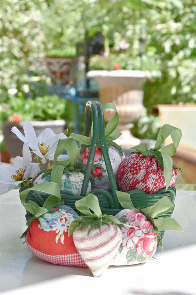 Fabric strawberries in basket.