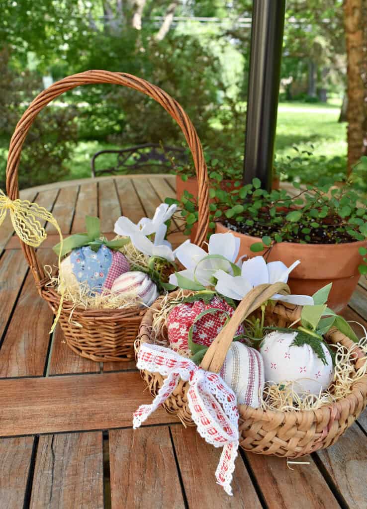 Fabric strawberries in baskets.