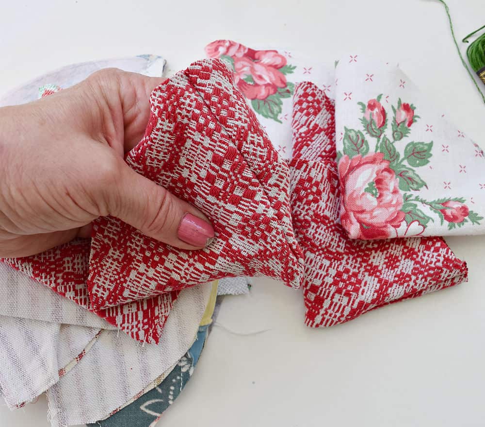 Crafting ucycled fabric strawberries with vintage fabrics.