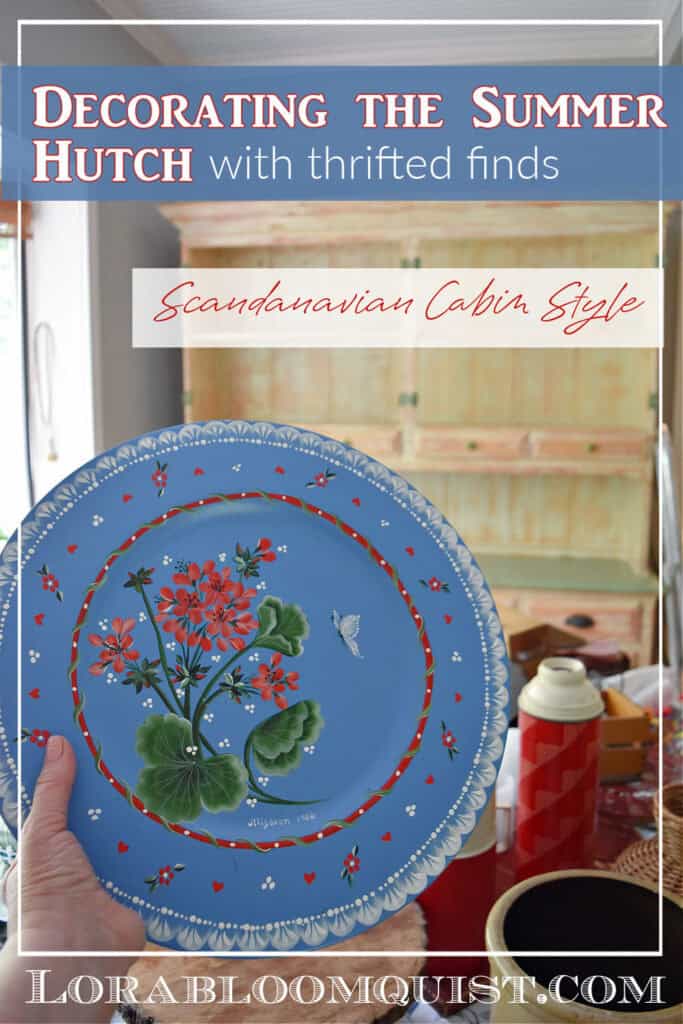 Hand painted blue plate with flowers as summer hutch decor.