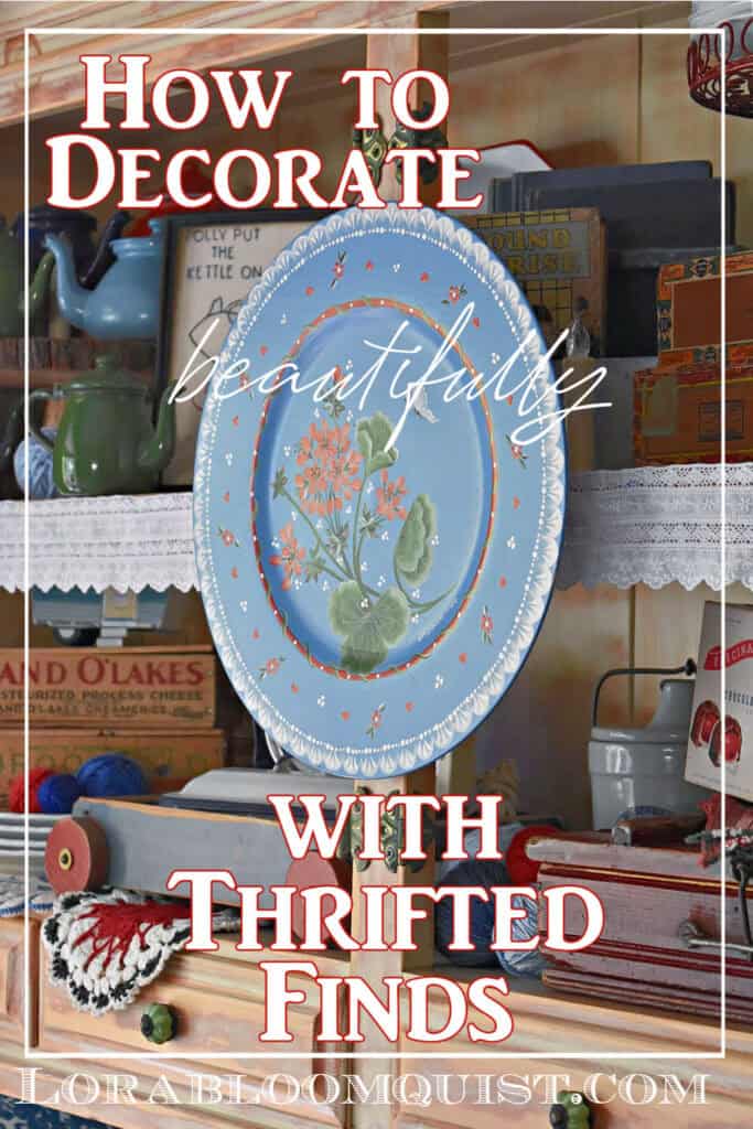 Hand painted blue wooden plate displayed in summer hutch.
