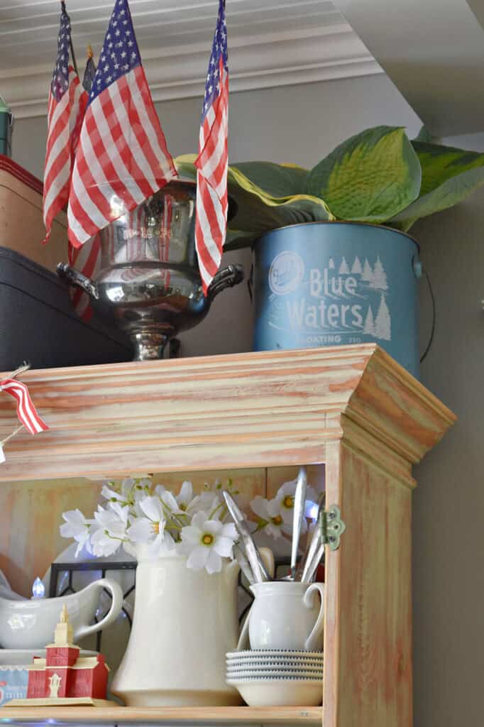 Patriotic hutch decor with vintage style.