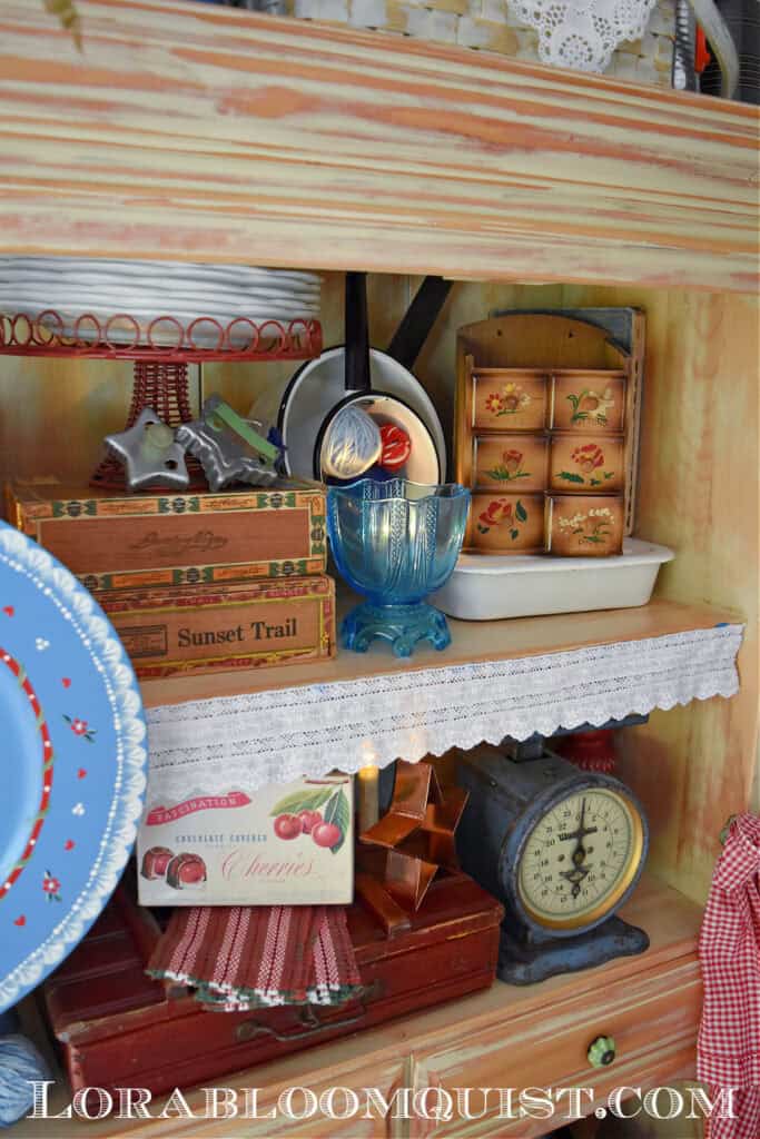 Vintage red, white and blue finds in summer hutch display.