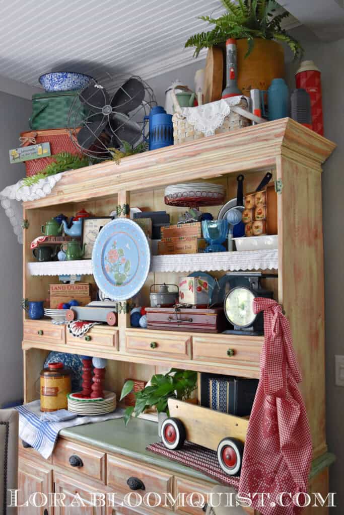 Summer hutch display with vintage thrifted finds.