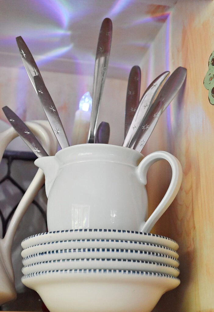 Retro star flatware in white ironstone pitcher.