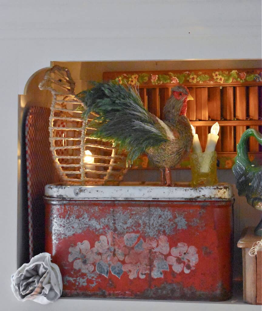 Rooster decorations on vintage metal box.