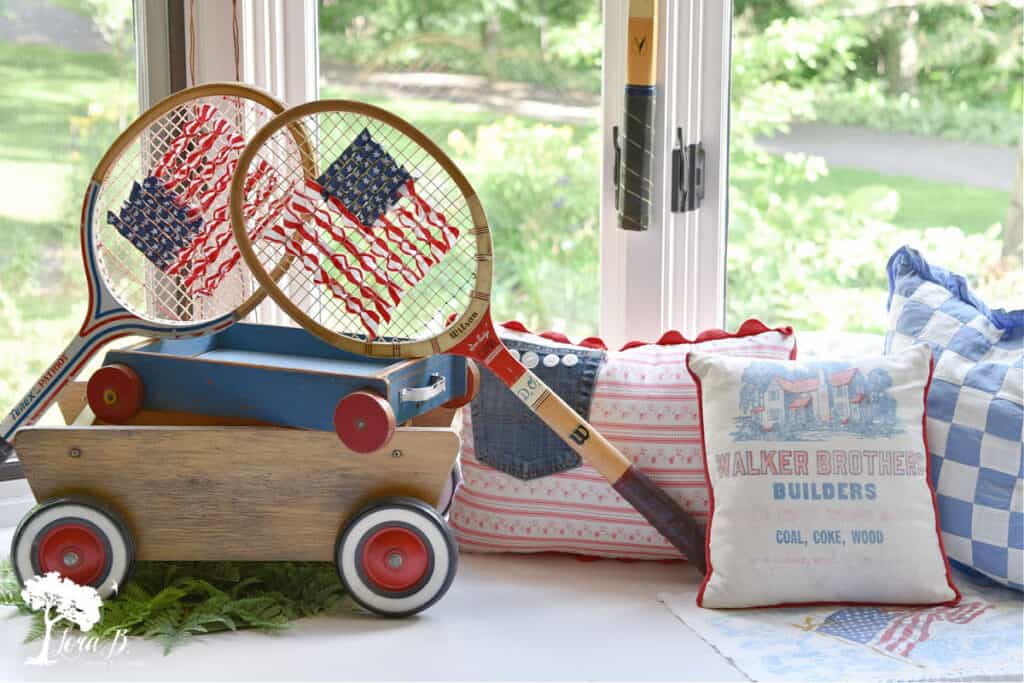 Repurposed old tennis rackets as flag decor