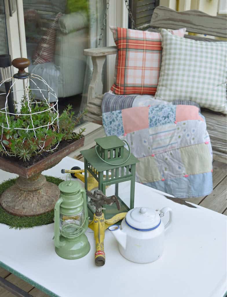 Enamelware coffee table with garden accessories.