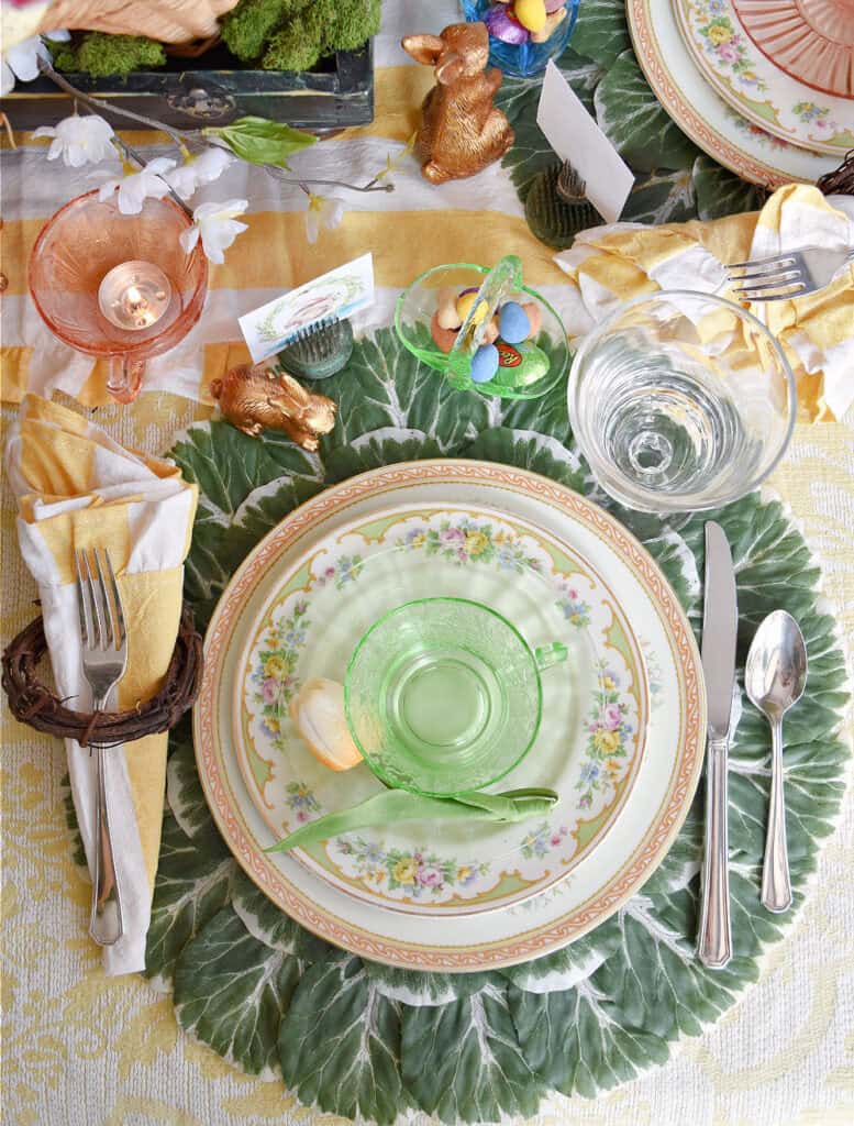 Easter table setting with vintage dishes and glassware.