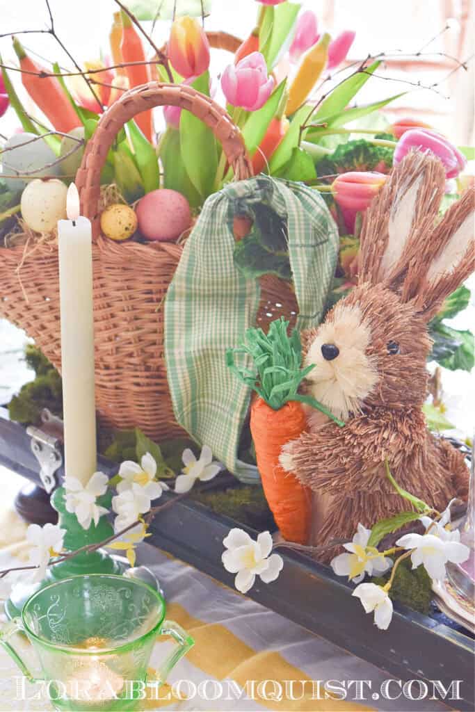 Easter centerpiece with bunny, candle, tulips.