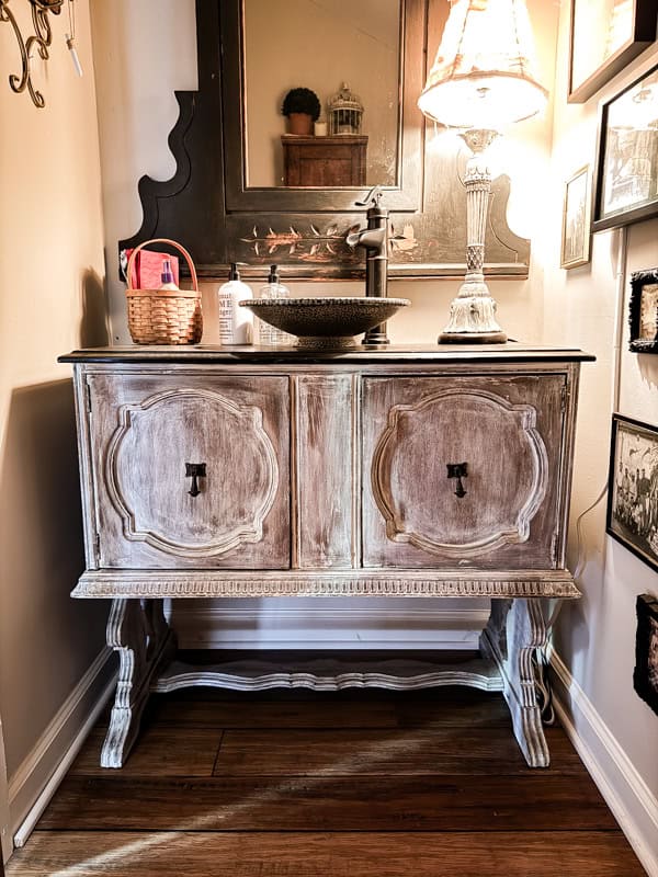 Vintage furniture as bathroom vanity.