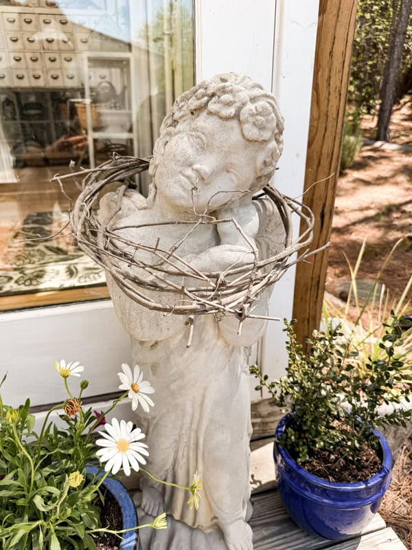 Angel with grapevine at Greenhouse Concrete Garden Statues