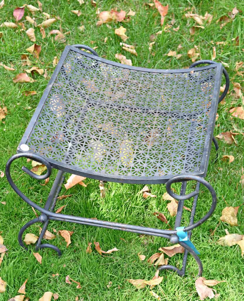Retro black metal stool.