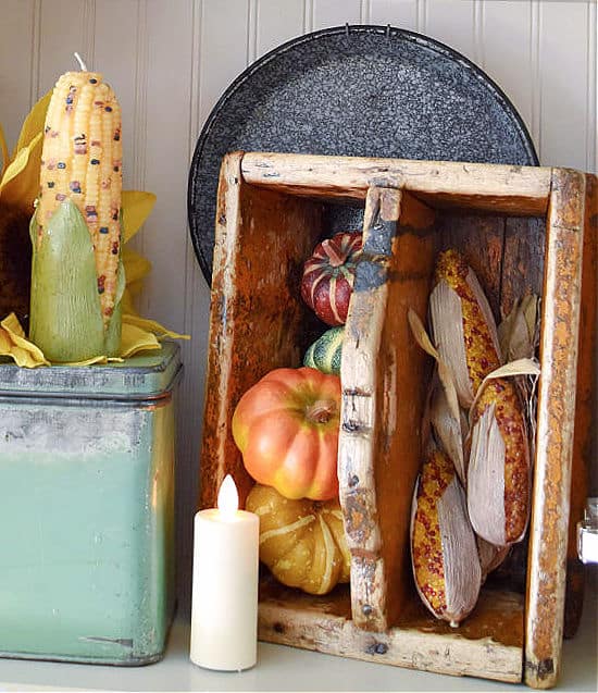 Antique tool caddy standing will Fall foliage.