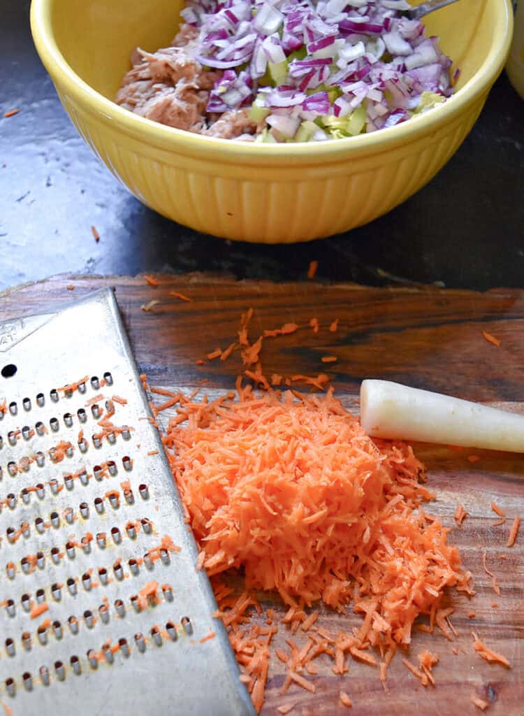Shredding carrots.