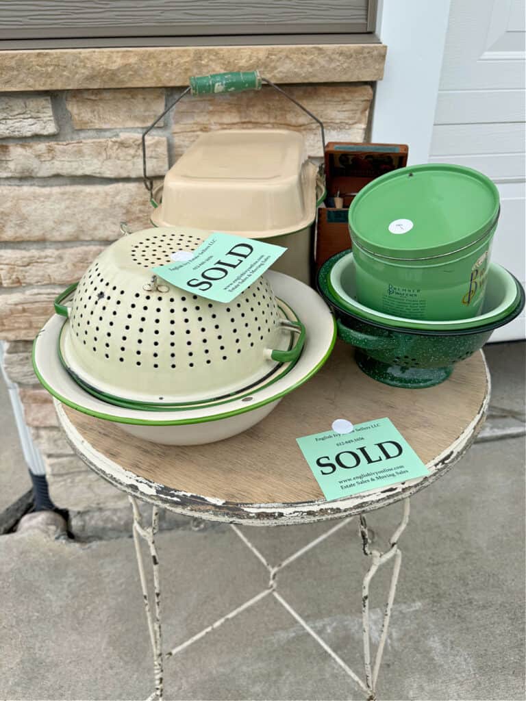 Vintage green and tan enamelware colanders and bowls with vintage estate sale finds.
