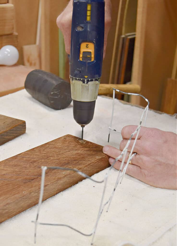 Drilling holes for fencing.