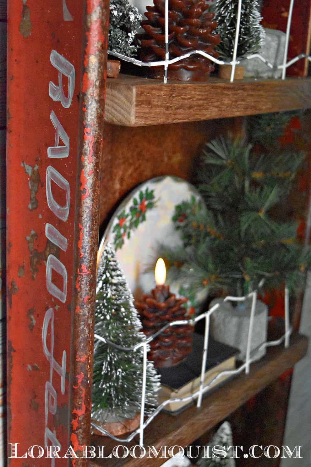 Upcycled vintage red wagon shelf with holiday decor.