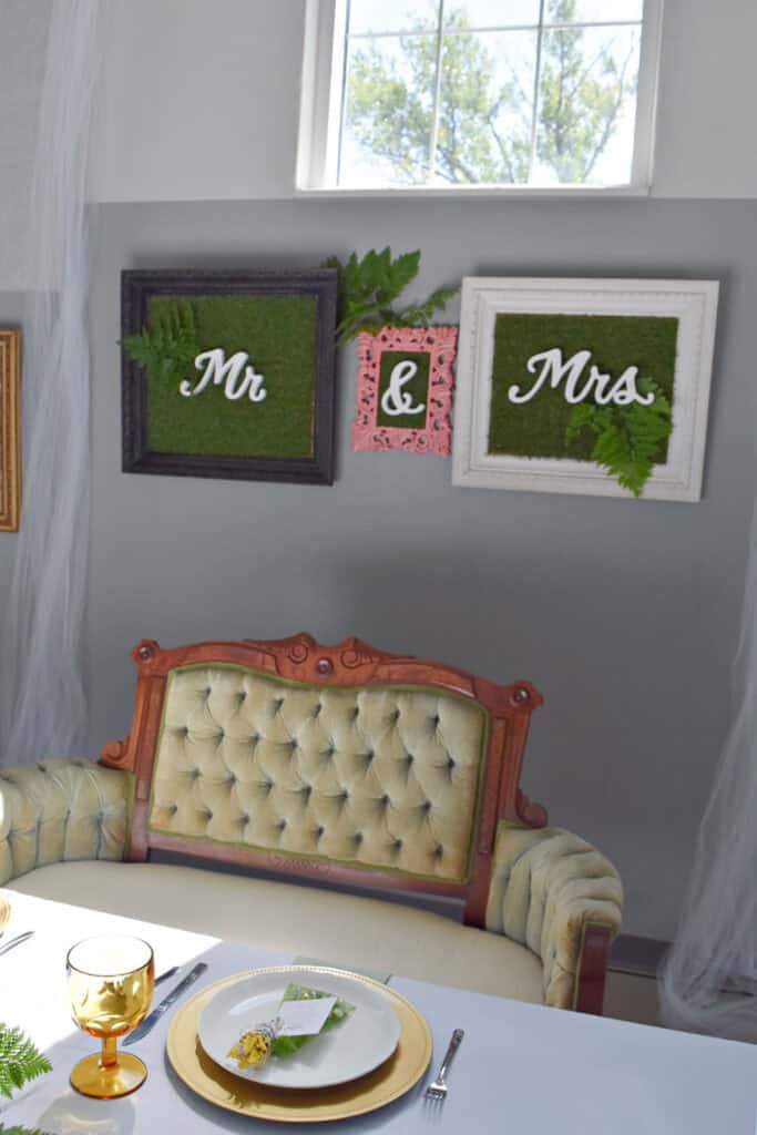 Velvet tufted loveseat for bride and groom.