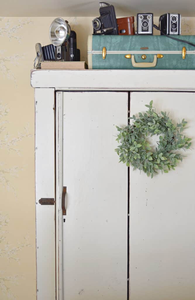 Cupboard with Suitcase on top