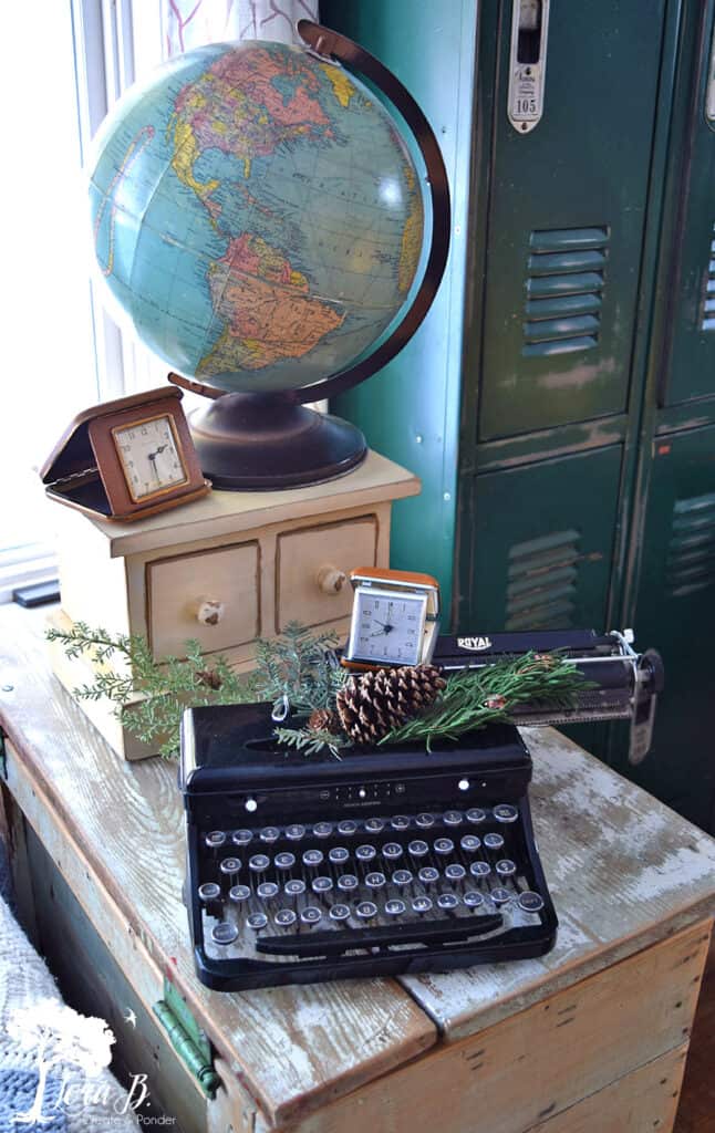 Winter living room decor with vintage globe, clocks and typewriter