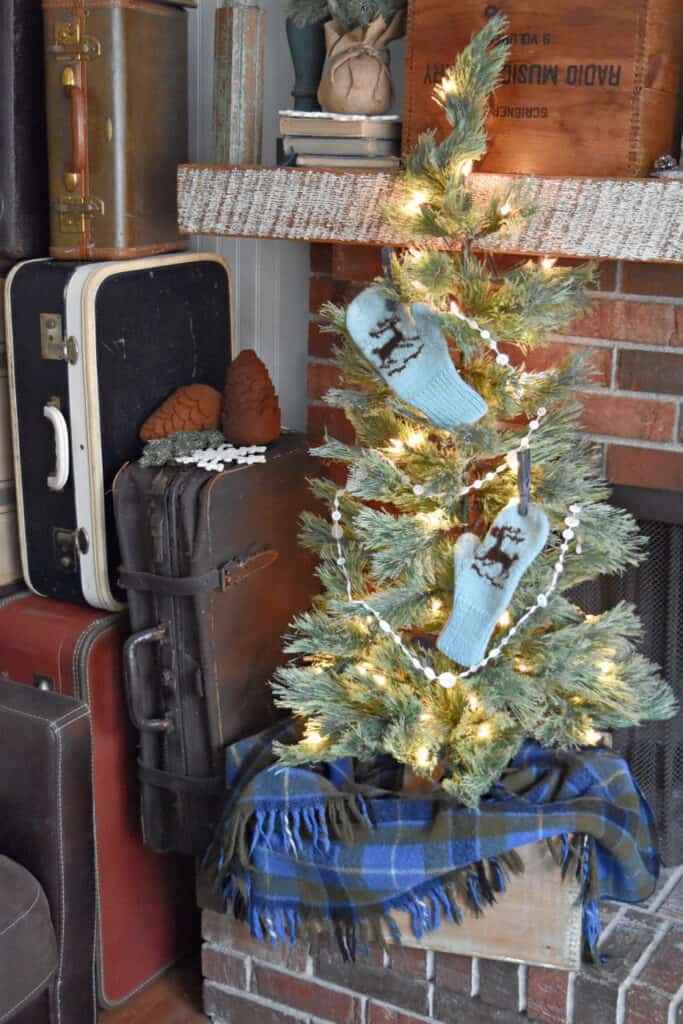 Mittens on tree as winter decor.