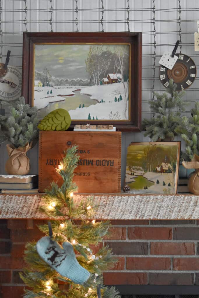 Vintage cabin art as winter decor in living room.