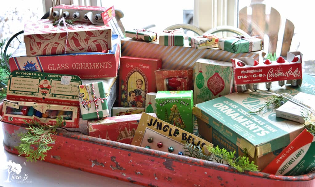 Vintage Christmas boxes fill an old red wagon.