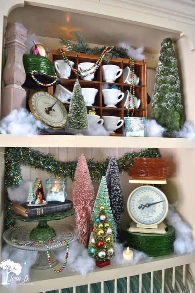 Vintage dishes and old scales decorate a Christmas kitchen