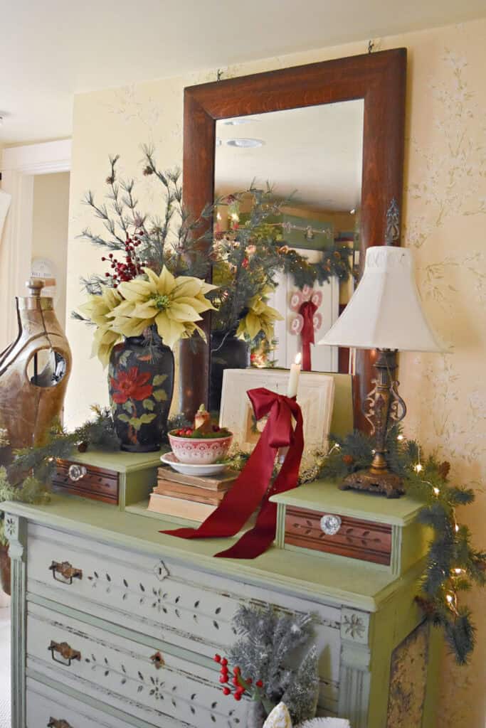 Christmas decorated vintage green painted dresser.