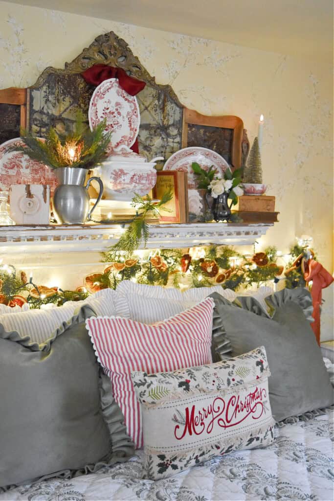 Vintage style Christmas decorated bedroom with red and white transferware.