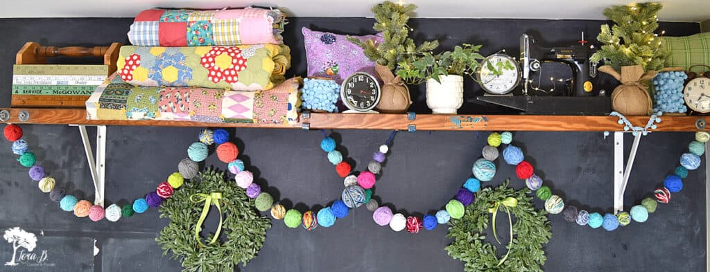 Yarn ball garland to display a craft room display shelf