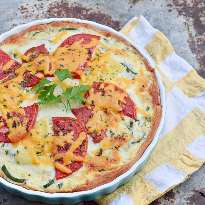 Zucchini quiche and yellow stripe napkin.