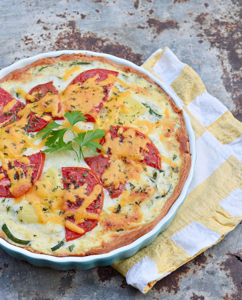 Zucchini quiche and yellow stripe napkin.
