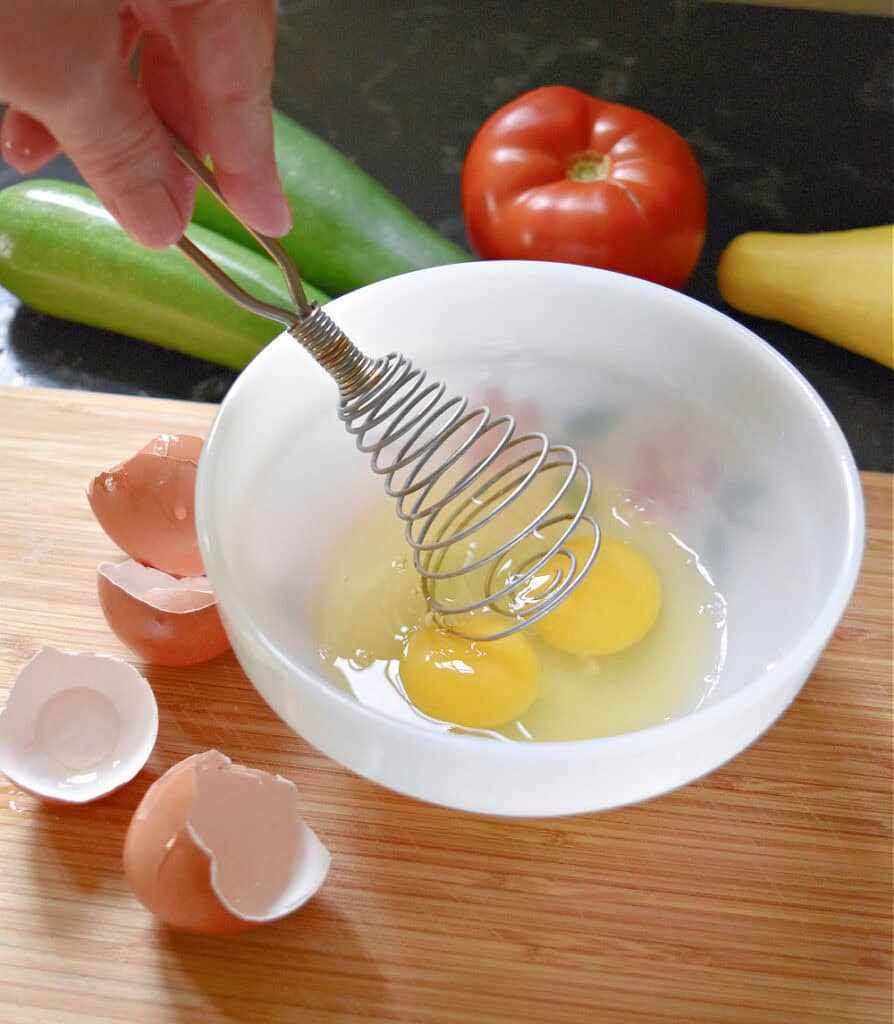 Whisking egg.