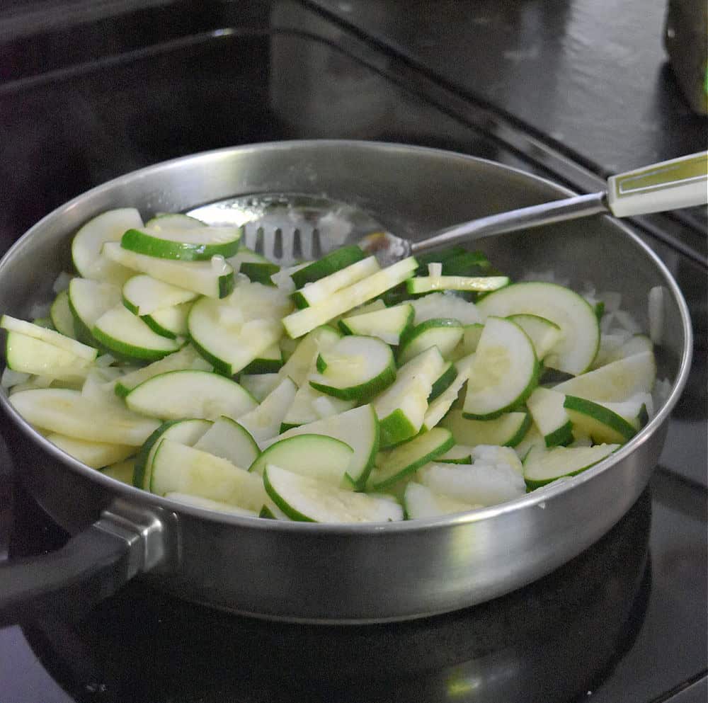 Sauteing zucchini and onions.
